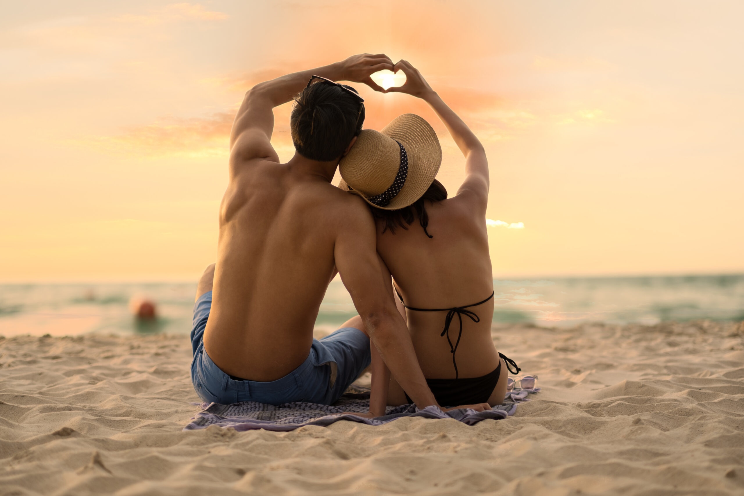 Asian couple enjoy the sunset